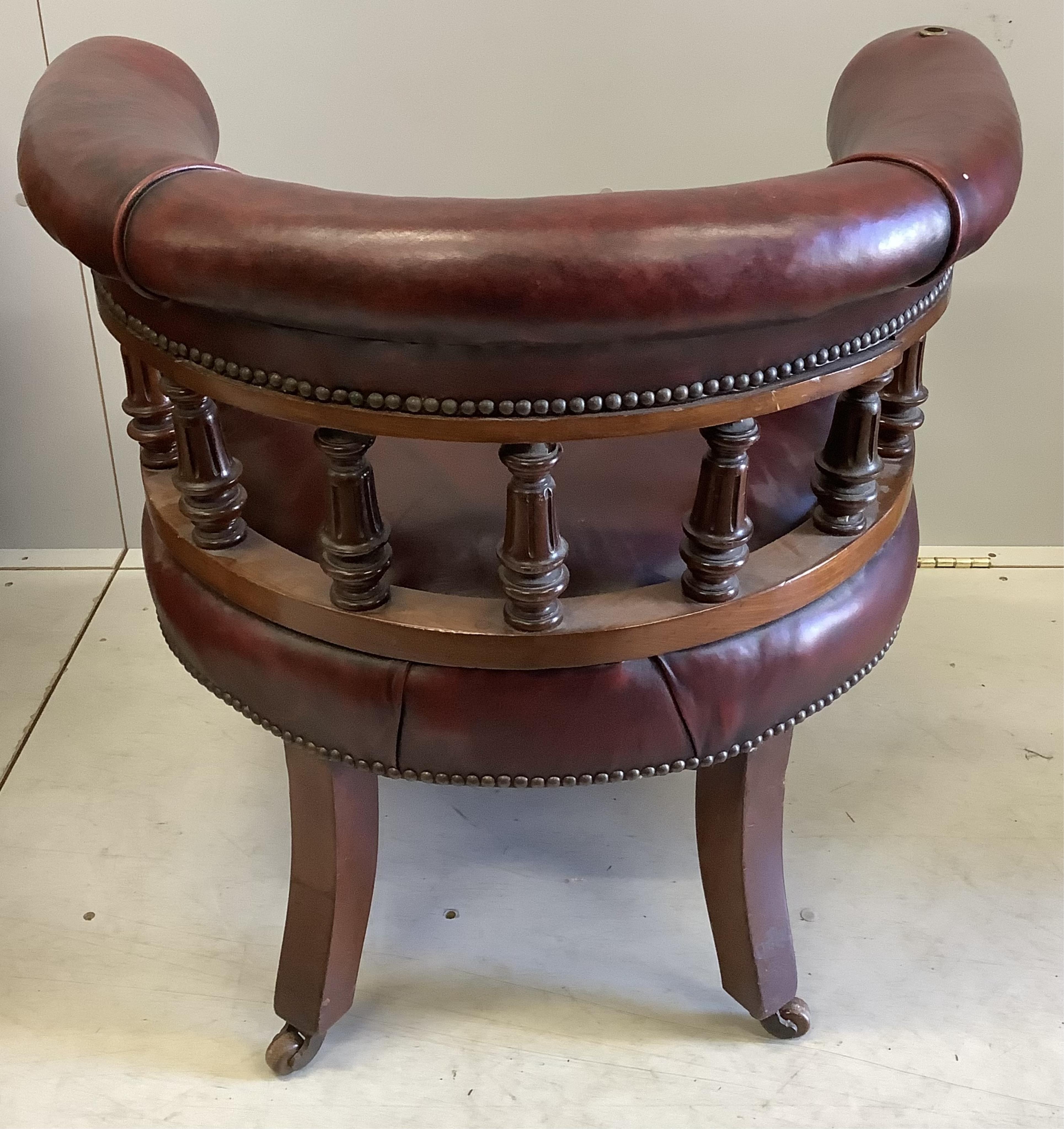 A Victorian walnut burgundy leather club chair, width 75cm, depth 64cm, height 70cm. Condition - good, although lacks reading stand